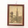 Vintage urban scene featuring a church spire and streetcar in sepia tones.