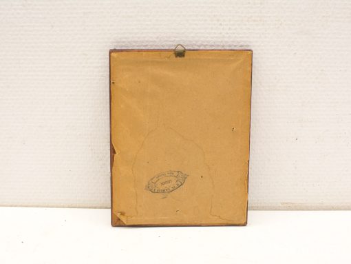 Aged wooden frame back with vintage charm, featuring worn paper and hanging hook.