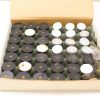 Vintage black and white disc set in protective box, ideal for collectors and technical applications.