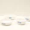 Elegant vintage white ceramic dishes with blue floral pattern for stylish serving.