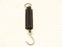 Vintage mechanical scale with hook and ring for accurate weight measurement in kitchens and workshops.