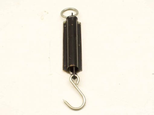 Vintage mechanical scale with hook and ring for accurate weight measurement in kitchens and workshops.