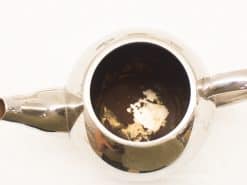 Elegant stainless steel teapot set, perfect for charming tea moments and stylish serving.