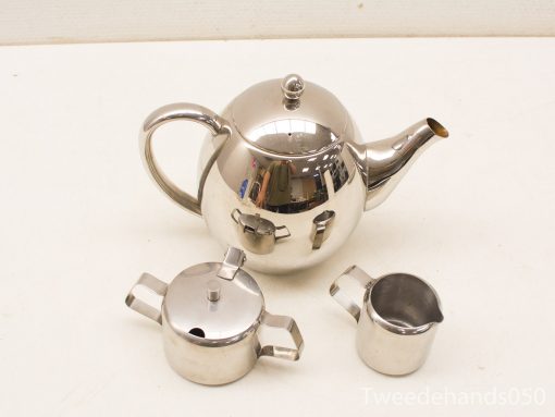 Elegant stainless steel teapot set with sugar bowl and cream jug for stylish tea service.