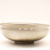 Elegant ceramic bowl with a handmade design, perfect for serving or as a decorative accent.