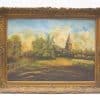 Serene countryside painting with church and village in ornate vintage frame, evoking rustic charm.