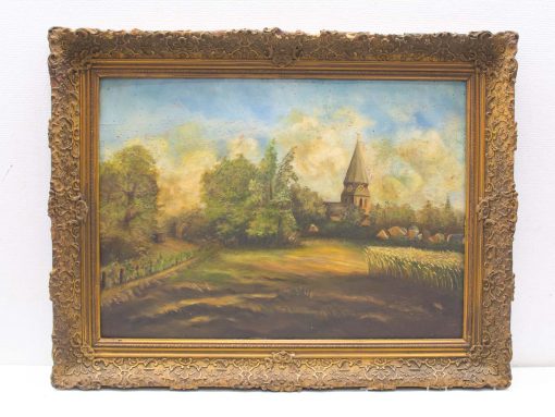 Serene countryside painting with church and village in ornate vintage frame, evoking rustic charm.