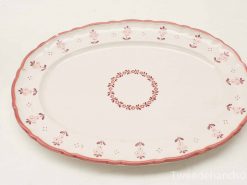 Elegant vintage oval platter with delicate pink floral design for special occasions.