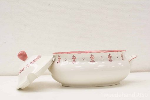 Elegant vintage ceramic casserole dish with pink floral design and scalloped edges.