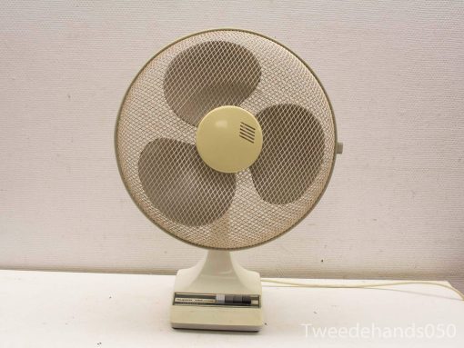 Vintage table fan with classic design and charming retro style, perfect for nostalgic decor.