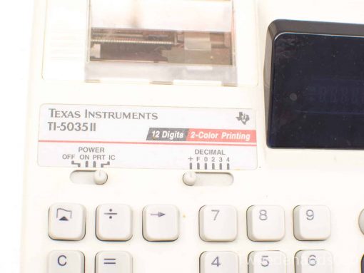 Vintage Texas Instruments TI-5035II calculator with dual-color printing and clear LCD display.