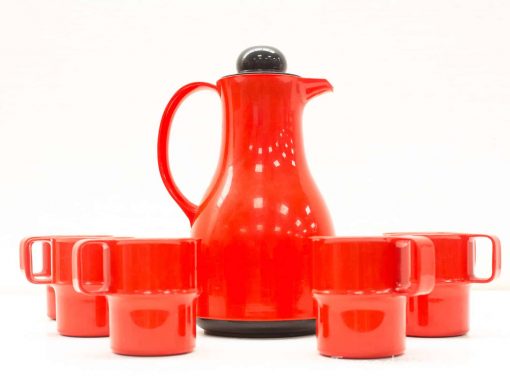 Red ceramic coffee pot set with four matching mugs, perfect for stylish coffee moments.