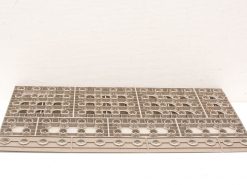 Rectangular plastic sheet with circular cutouts for efficient organization and storage of small items.