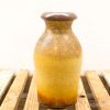 Unique earthy gradient ceramic vase with elegant design, perfect for decor or floral arrangements.