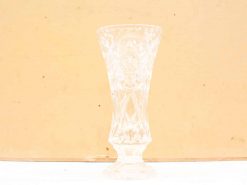 Elegant crystal vase with intricate designs, perfect for displaying flowers and enhancing décor.