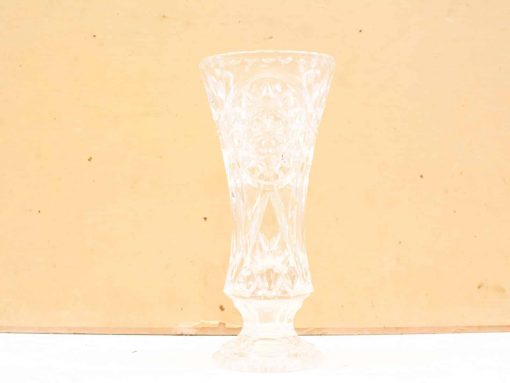 Elegant crystal vase with intricate designs, perfect for displaying flowers and enhancing décor.