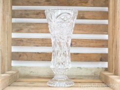 Elegant crystal vase with geometric patterns, perfect for showcasing flowers and enhancing decor.