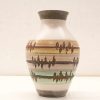 Elegant pastel-striped ceramic vase for modern home decor and floral arrangements.