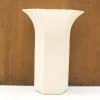 Elegant vintage vase with scalloped edge and vertical grooves, perfect for any decor style.