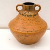 Elegant terracotta pot with geometric patterns, perfect for decoration or practical use.
