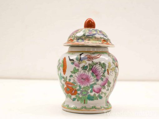 Chinese porcelain jar with floral design, perfect for collectors and elegant home décor.