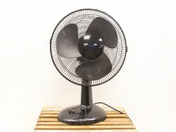 Sleek black pedestal fan with three blades and adjustable speeds for optimal home cooling.