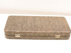 Stylish vintage case with textured exterior for storing jewelry, documents, and valuable items.