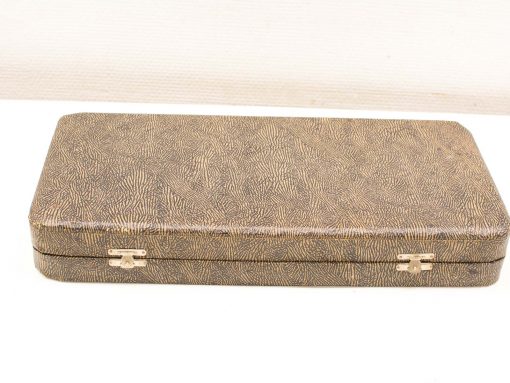 Stylish vintage case with textured exterior for storing jewelry, documents, and valuable items.