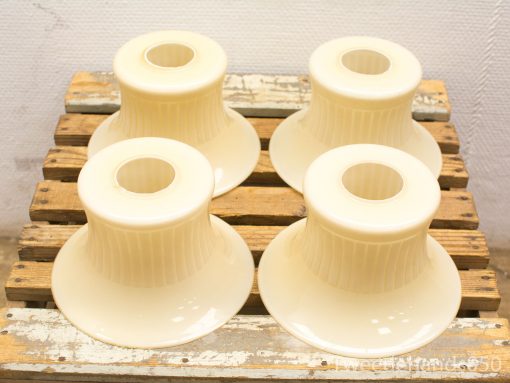 Charming vintage lamp shades on a rustic crate, perfect for elegant home decor accents.