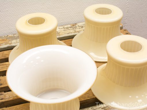 Elegant beige vases on rustic wood, perfect for home decor and floral arrangements.