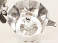 Shiny vintage aluminum moka pot for brewing rich Italian coffee with elegant design.
