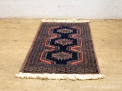 Elegant vintage Persian area rug 20641 with geometric and floral motifs on a deep blue background.