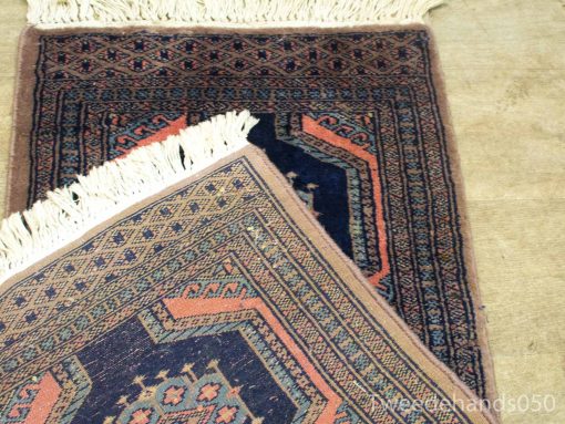 Stunning vintage Persian rug with intricate geometric patterns in rich navy and burgundy hues.