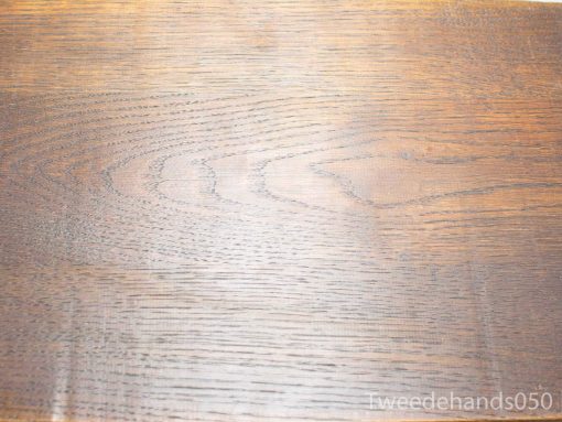Elegant vintage wooden side table showcasing unique grain and rich dark finish.