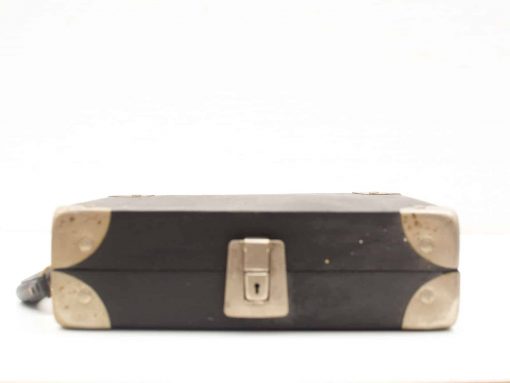 Classic black vintage suitcase with metal latch and leather handle, perfect for stylish travel.