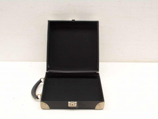 Classic black leather briefcase with ergonomic handle and spacious interior for professionals.