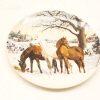 Winter scene decorative plate featuring three horses in a serene snowy landscape.