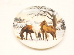 Winter scene decorative plate featuring three horses in a serene snowy landscape.