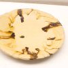Elegant beige ceramic plate with swirling brown patterns, perfect for serving or decorative display.