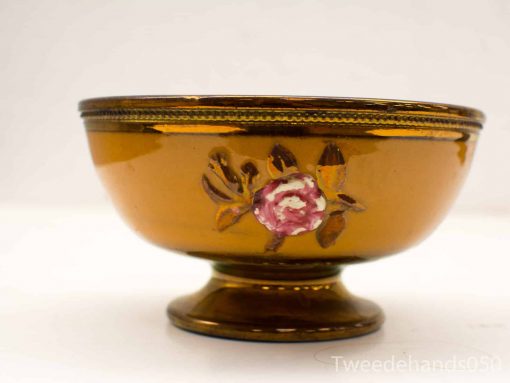 Elegant amber bowl with hand-painted roses, perfect for decor or serving.