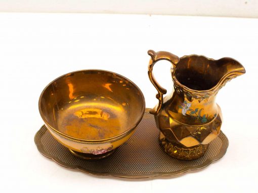 Elegant vintage gold pitcher, bowl, and tray set for timeless decor and refined table settings.