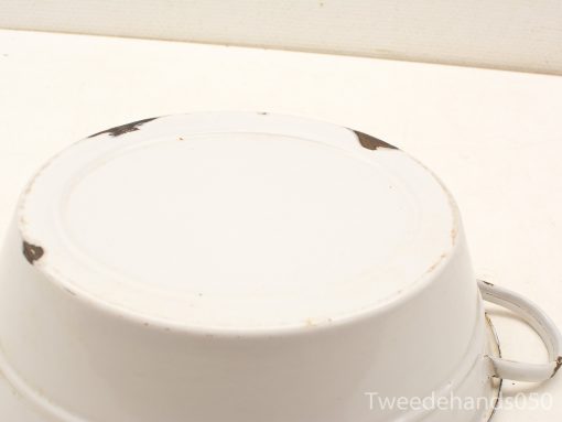 Vintage ceramic bowl bottom highlighting wear and unique charm from years of use.