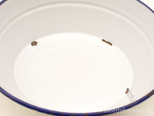 White ceramic bowl with blue trim, featuring vintage charm and subtle imperfections.
