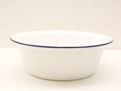 Classic white bowl with blue rim, ideal for serving and decorative use.