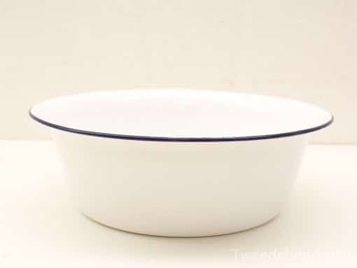 Classic white bowl with blue rim, ideal for serving and decorative use.