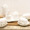 Elegant 16-piece vintage porcelain tea set for a refined afternoon tea experience.