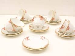Elegant white tea set with floral design and gold accents for stylish gatherings.