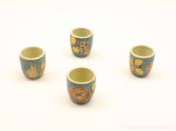 Vibrant vintage ceramic cups with floral designs, perfect for espresso or decorative use.