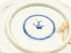 Elegant blue floral porcelain plate with a timeless design for decorative or daily use.
