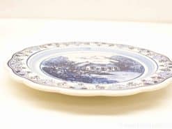 Elegant Delft Blue plate depicting a charming house and serene landscape for home decor.